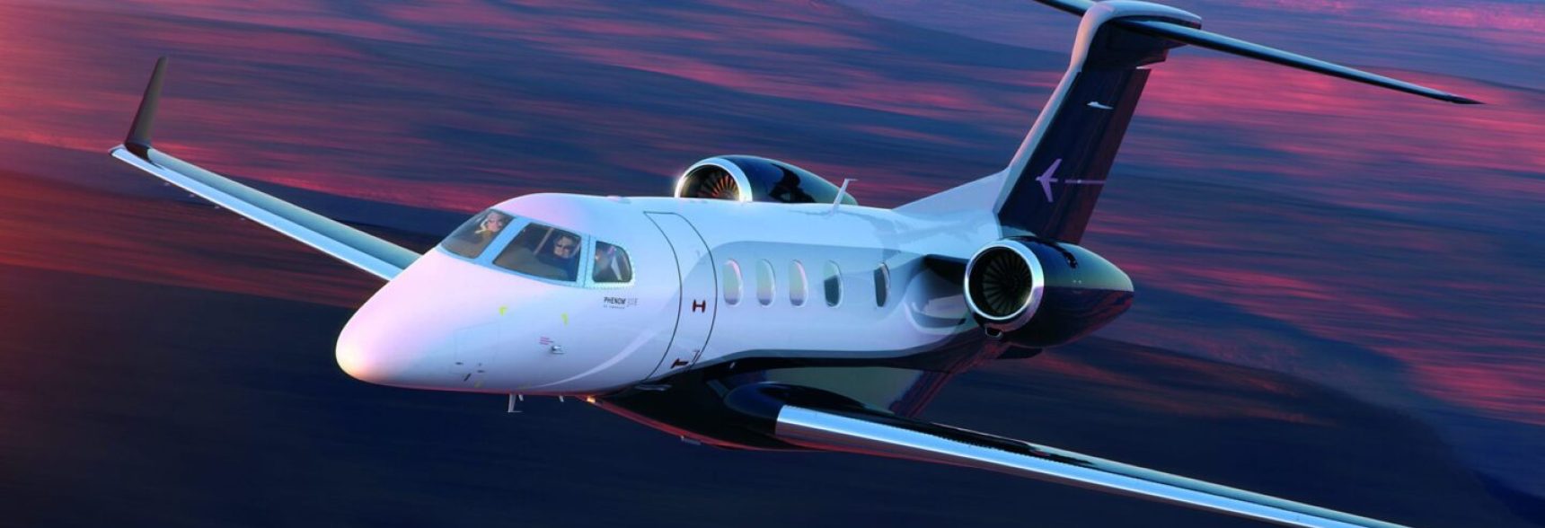 Phenom-300E_Exterior-Flight-Sunset-scaled